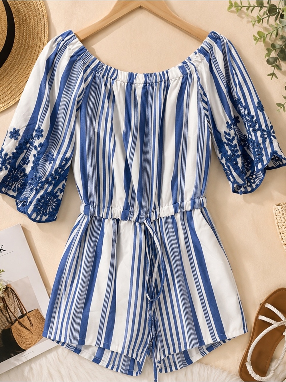 Beautiful Romper/details on sleeves.Can be worn off the shoulder.Slightly used.